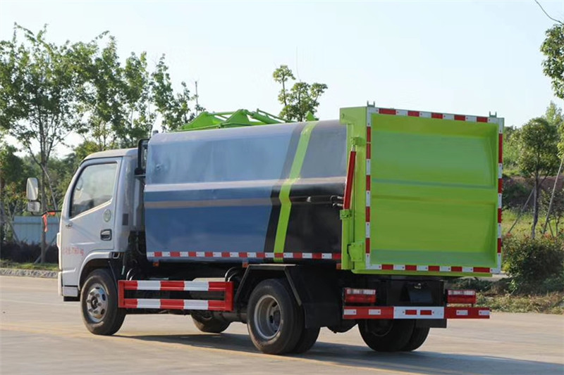 國六小多利卡6方側裝壓縮垃圾車{i}