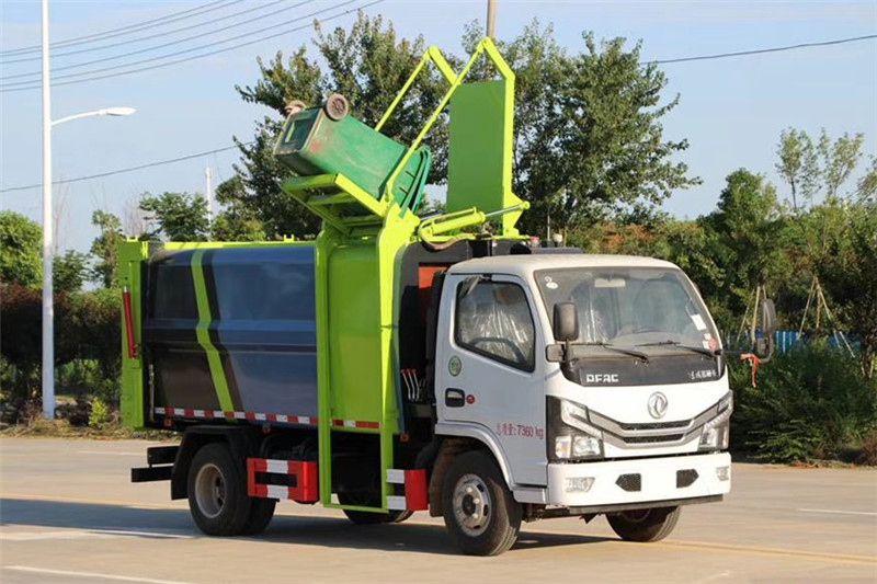 國六小多利卡6方側裝壓縮垃圾車{i}